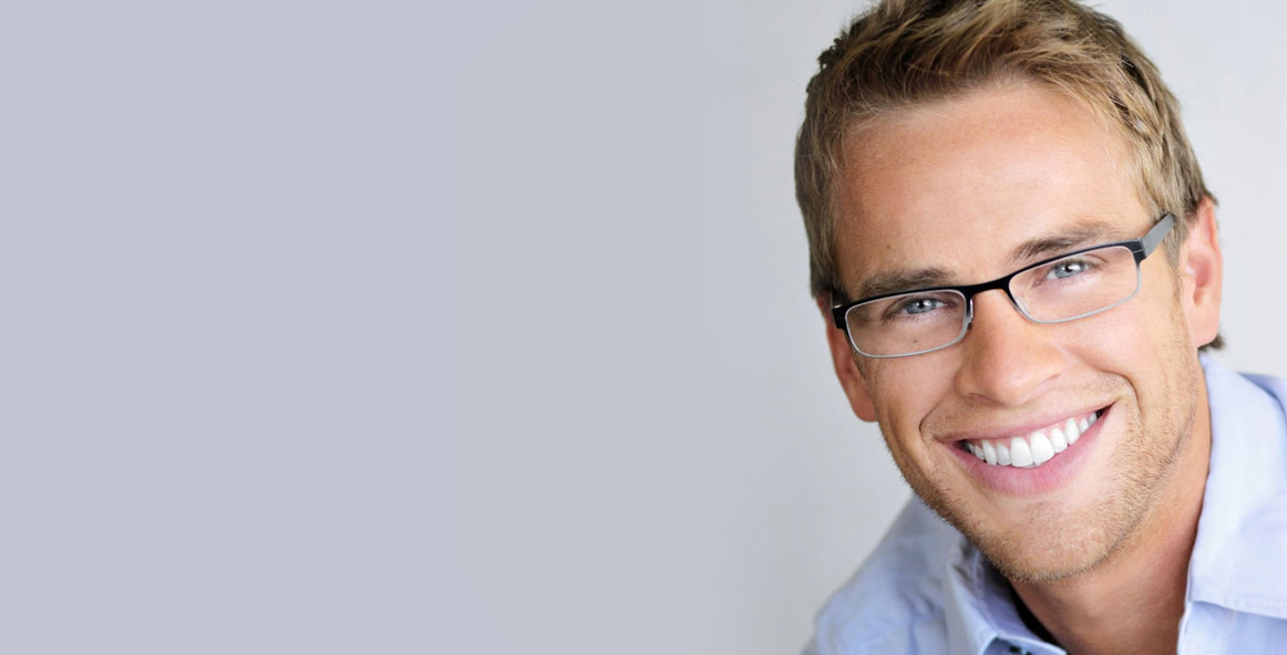 handsome man with clean simple glasses smiling